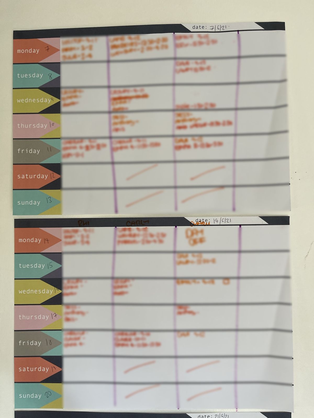 A paper rota diary from 2021, each day filled in by hand in orange pen, customer names blurred